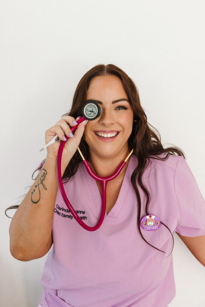 Smiling healthcare worker using stethoscope in personal branding photoshoot